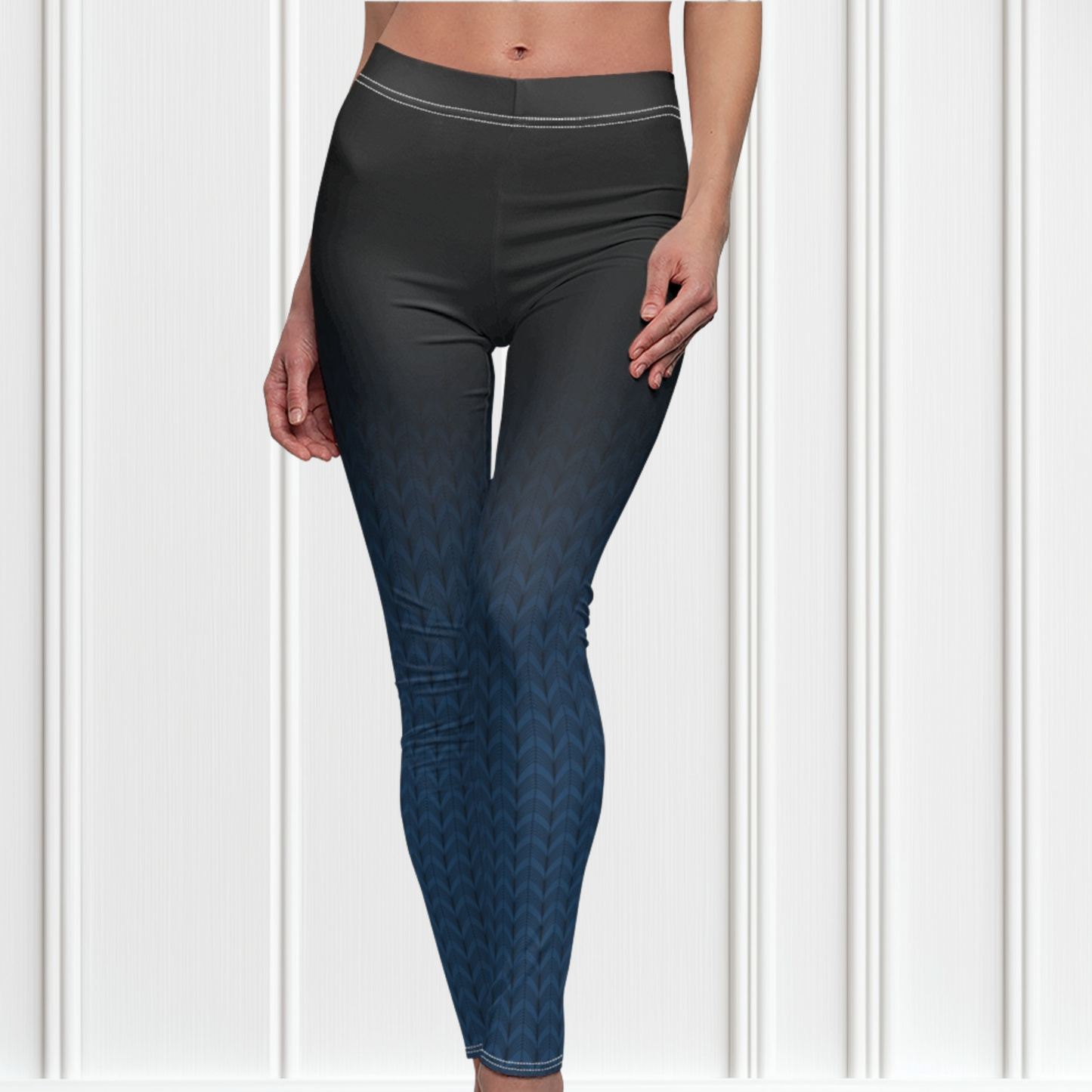 A pair of high waisted women's handmade custom leggings with a ombre pattern that starts as black at the waistline then shifts to a deep blue color at the bottom, there is a black wave pattern that is superimposed overtop and it blends into the black at the waistline.