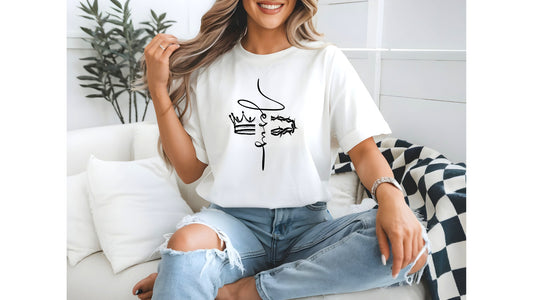 On the front of this custom Christian t-shirt is the name of Jesus in a cursive front from the top of the shirt facing towards the bottom, there is a crown on one side of the name and a crown of thorns on the other side of the name.