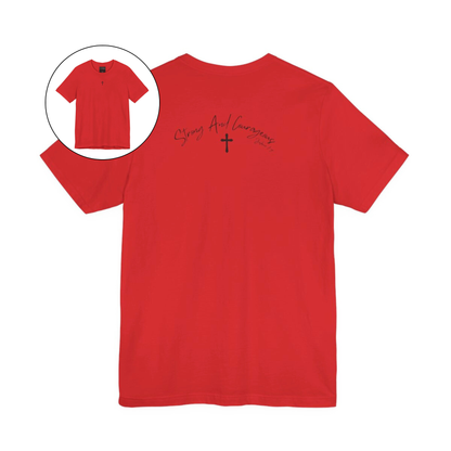 On the front center of this Christian shirt is a small Jesus cross, on the back of the is short sleeve tee is the scripture Strong and Courageous Joshua 1:9