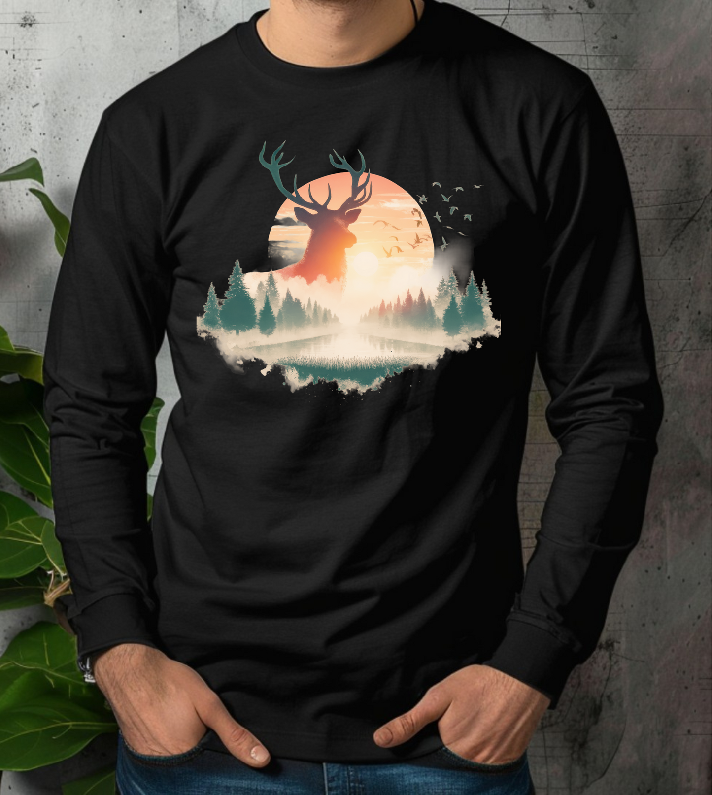 On the front of this custom unisex long sleeve shirt is beautiful landscape at dawn, there is a river in the middle with pine trees on either side, the sun is setting in the background with a large elk in the distance standing in front of the sun.