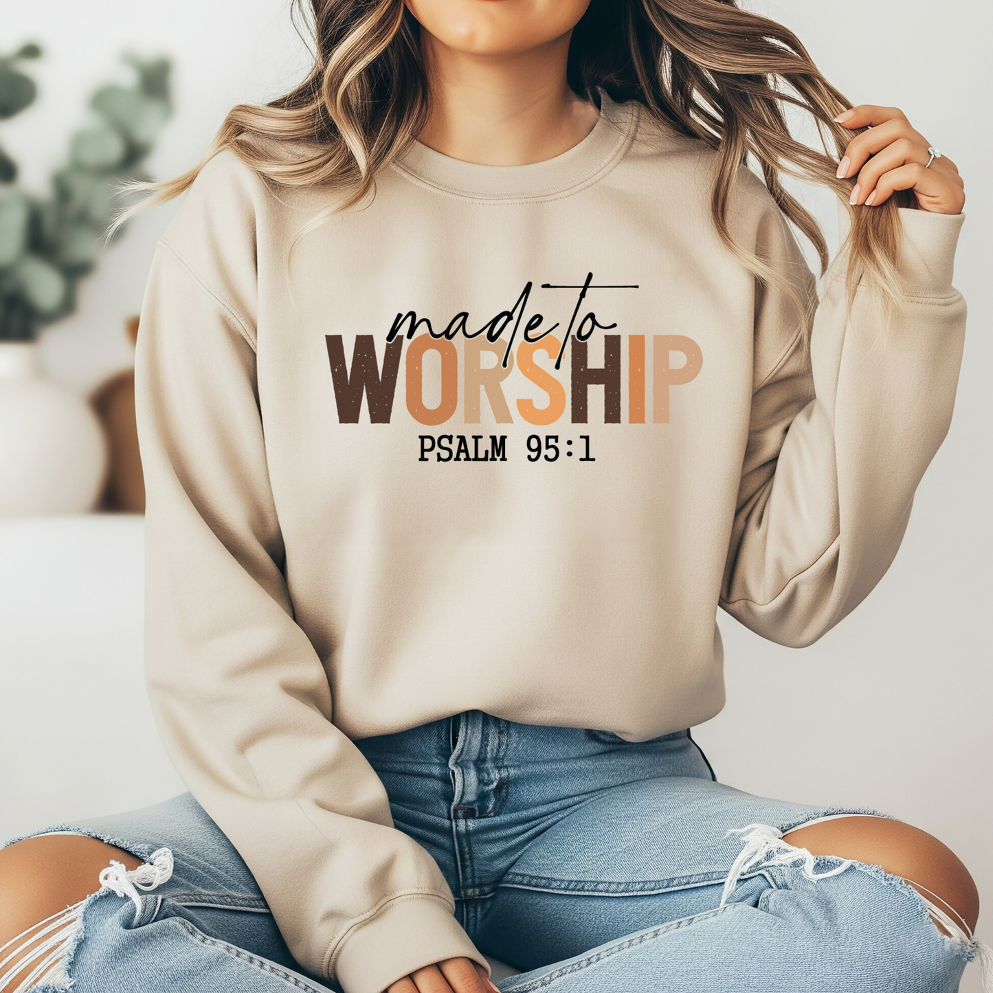 On the front of this Christian pullover sweatshirt it says Made To Worship Psalm 95:1, the word worship is done in large block letters with every letter being a different shade of brown.