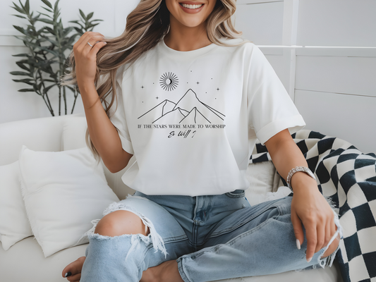 On the front of this custom Christian short sleeve shirt is a line drawing of mountains, and a moon and stars above the mountains, underneath the image are the words If the stars were made to worship so will I.