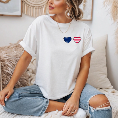 This super soft unisex t-shirt has a image of a pair of heart shaped sunglasses over the front left chest of the shirt, the American flag is inside the sunglasses. Perfect for 4th of July celebrations.