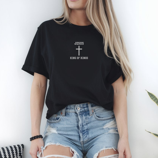 On the front of this Christian super soft t-shirt are the words Jesus King of Kings embroidered in silver thread with a Jesus cross in between the words on the front center of this faith filled shirt.