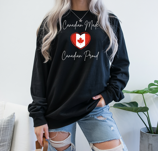 On the front of this custom Canadian patriotic long sleeve t-shirt are the words Canadian Made Canadian Proud in a beautiful cursive font, there is a Canadian flag in the middle that is in the shape of a heart.