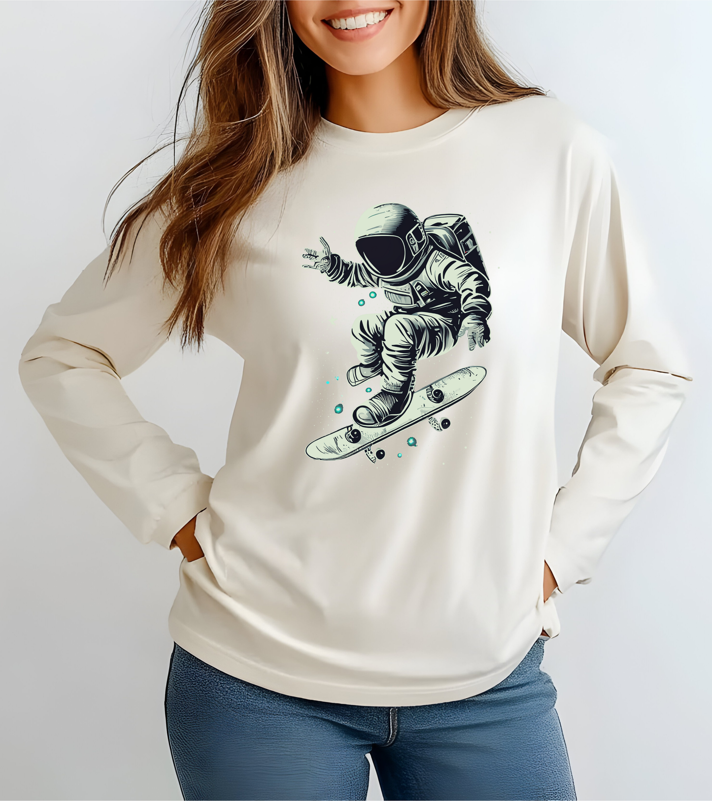 On the front of this custom unisex long sleeve shirt is an image of an astronaut riding a skateboard, there are a bunch of stars around the astronaut.