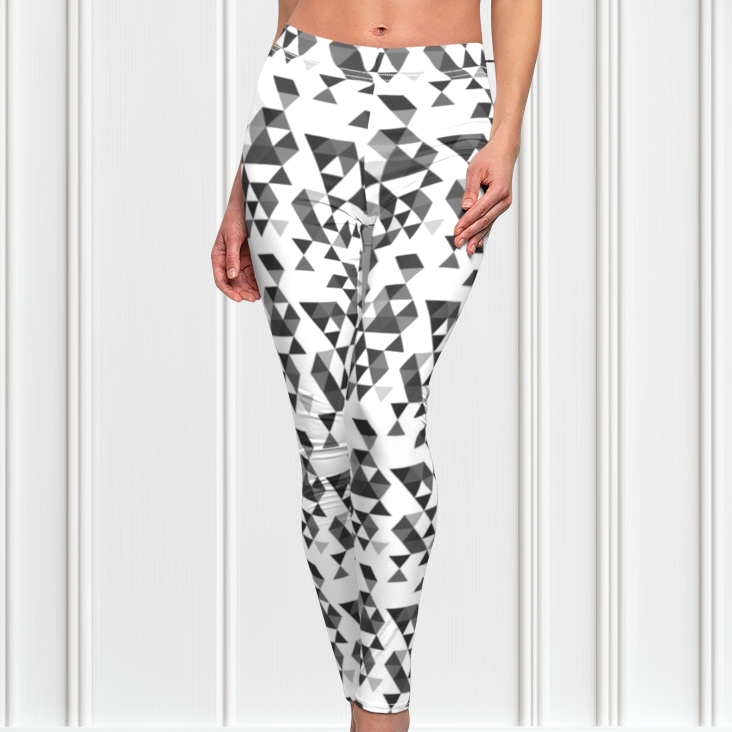 A  pair of women's handmade custom high waisted leggings, the leggings have a black, grey and white geometric pattern all across the entire pair of workout leggings.