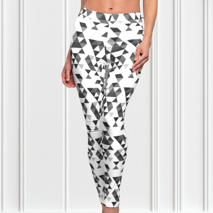 A  pair of women's handmade custom high waisted leggings, the leggings have a black, grey and white geometric pattern all across the entire pair of workout leggings.