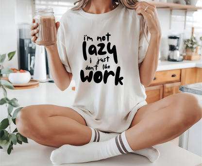 On the front of this custom short sleeve shirt in large bubble letters are the words I'm not lazy I just don't like work.