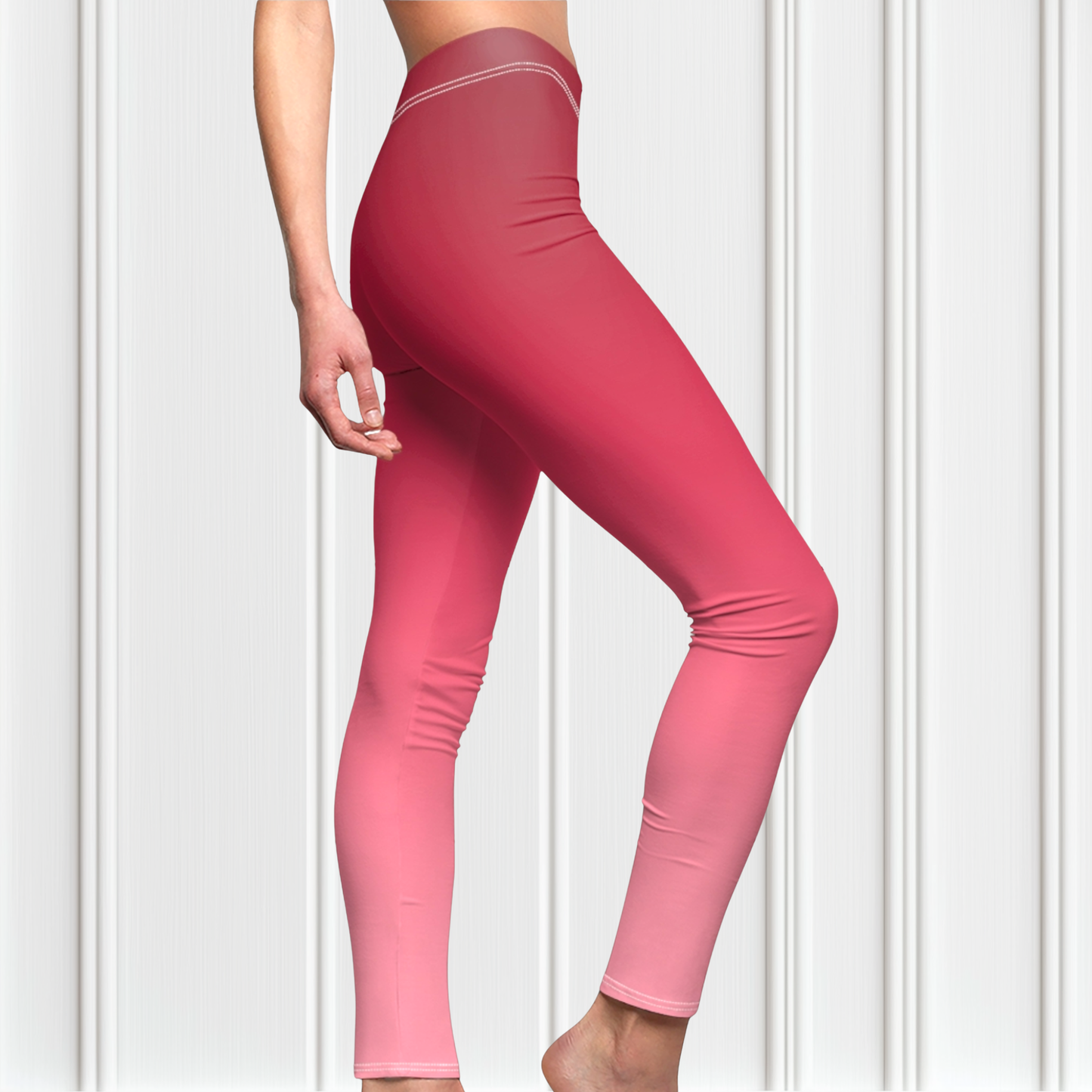 These custom handmade women's high waisted leggings have a pink ombre design with the top of the pants being a dark pink then it fading to a light baby pink at the ankles of the pants.