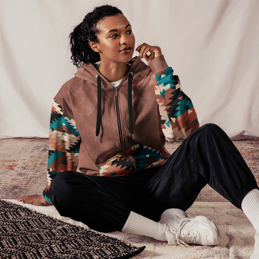 This custom unisex zip up hoodie has a western design to it with the front and the back of the hoodie being washed brown, each sleeve, the front pockets along with the inside of the hood have a brown, cream and turquoise Aztec pattern.