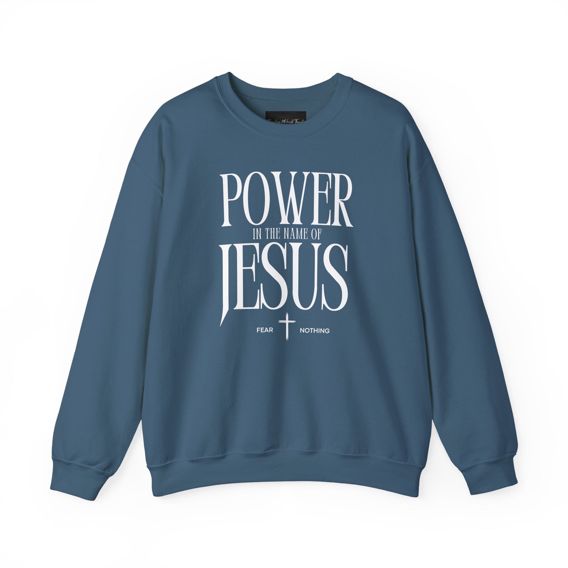 On the front of this Christian pullover sweatshirt it says Power In The Name Of Jesus with a Jesus cross underneath it, on either side of the cross are the words Fear and Nothing.