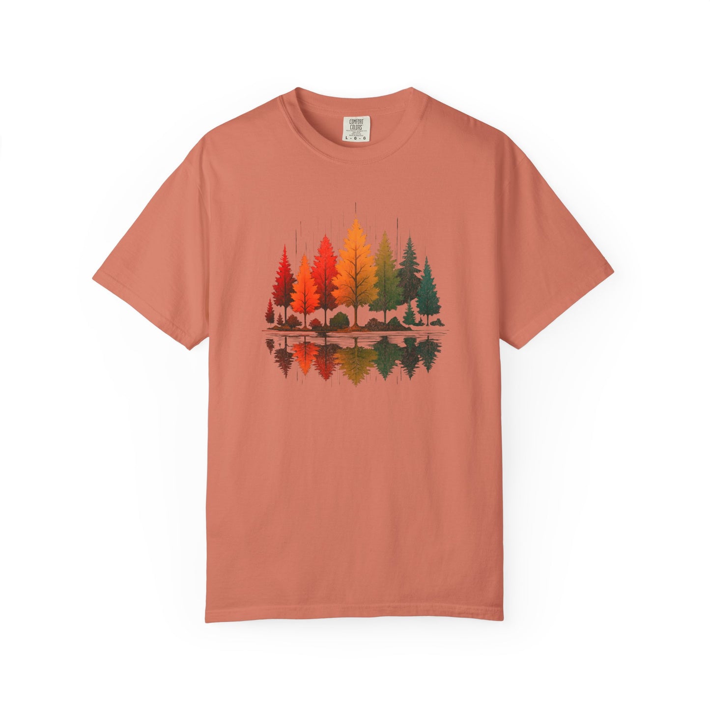 On the front of this custom comfort colors short sleeve shirt is a image of trees in the fall time with all the different fall colors, the trees reflection is right underneath making them look like they are above water.