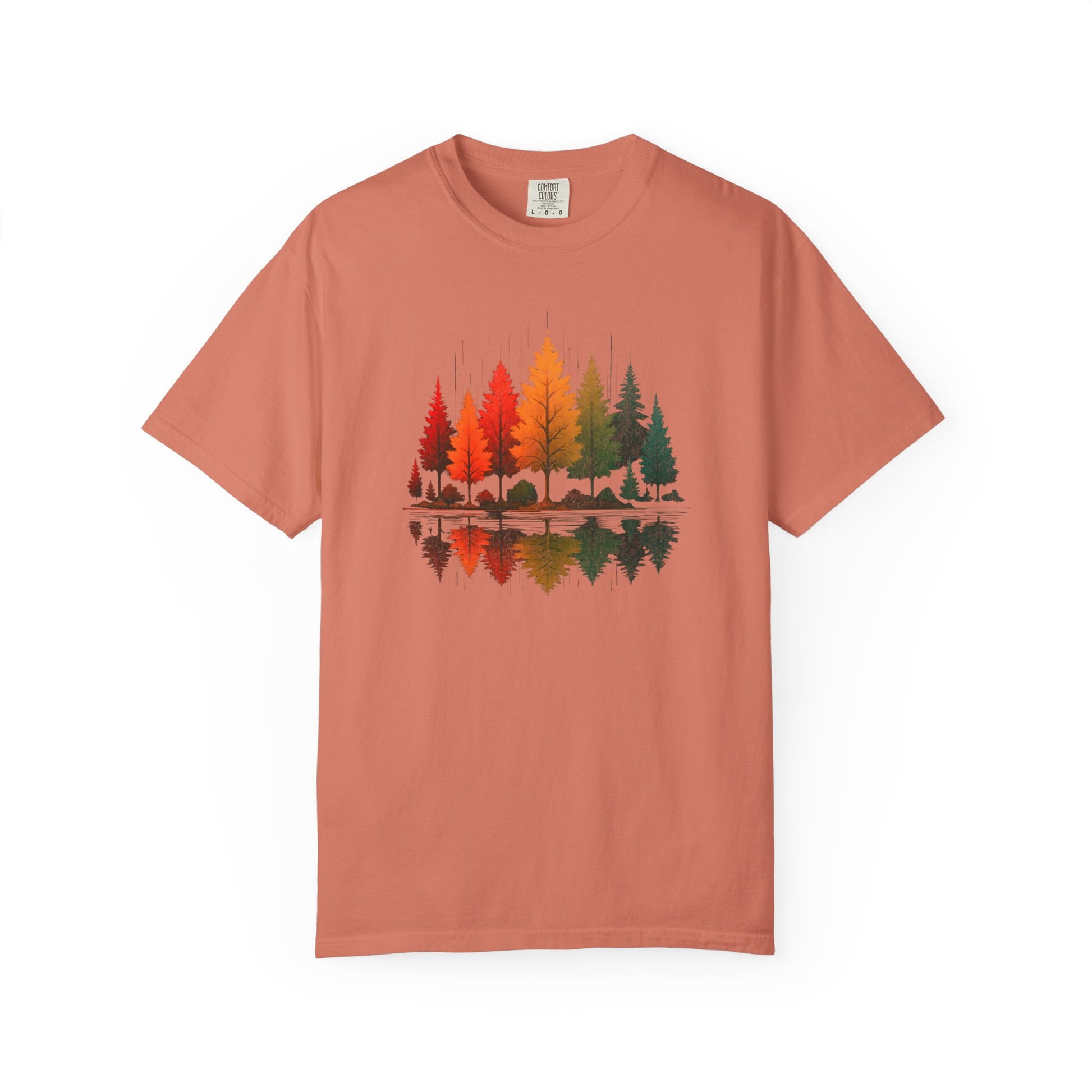 On the front of this custom comfort colors short sleeve shirt is a image of trees in the fall time with all the different fall colors, the trees reflection is right underneath making them look like they are above water.