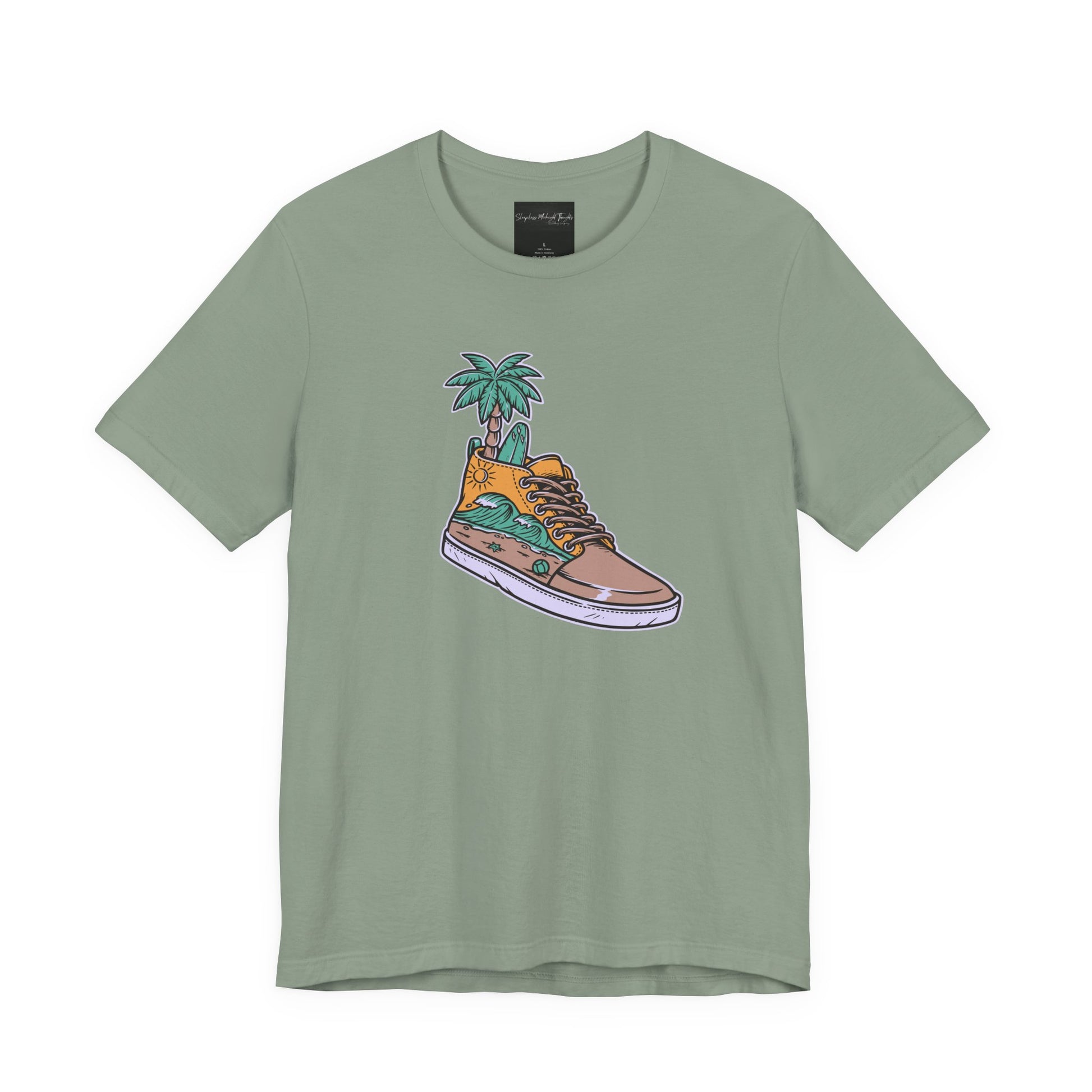 On the front of this custom handmade short sleeve shirt is an image of a high top running shoe with ocean waves running along the side of the shoe, coming out of the top of the shoe where your foot goes is a palm tree and a surf board.