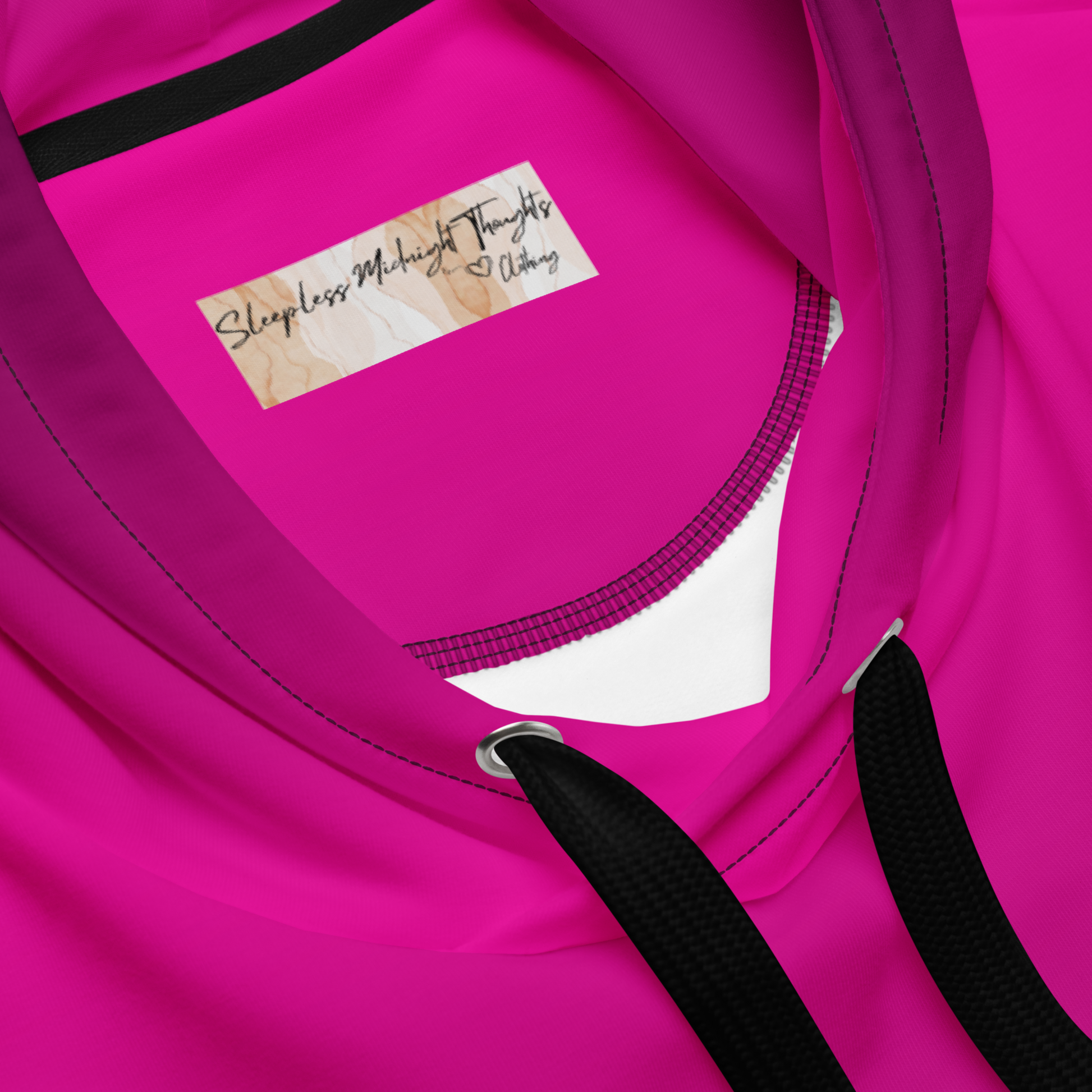 A handmade custom women's pullover hooded sweatshirt that has an ombre design with the top of the hoodie being a bright hot pink then it gradually fading to a very deep purple at the bottom of the hoodie.