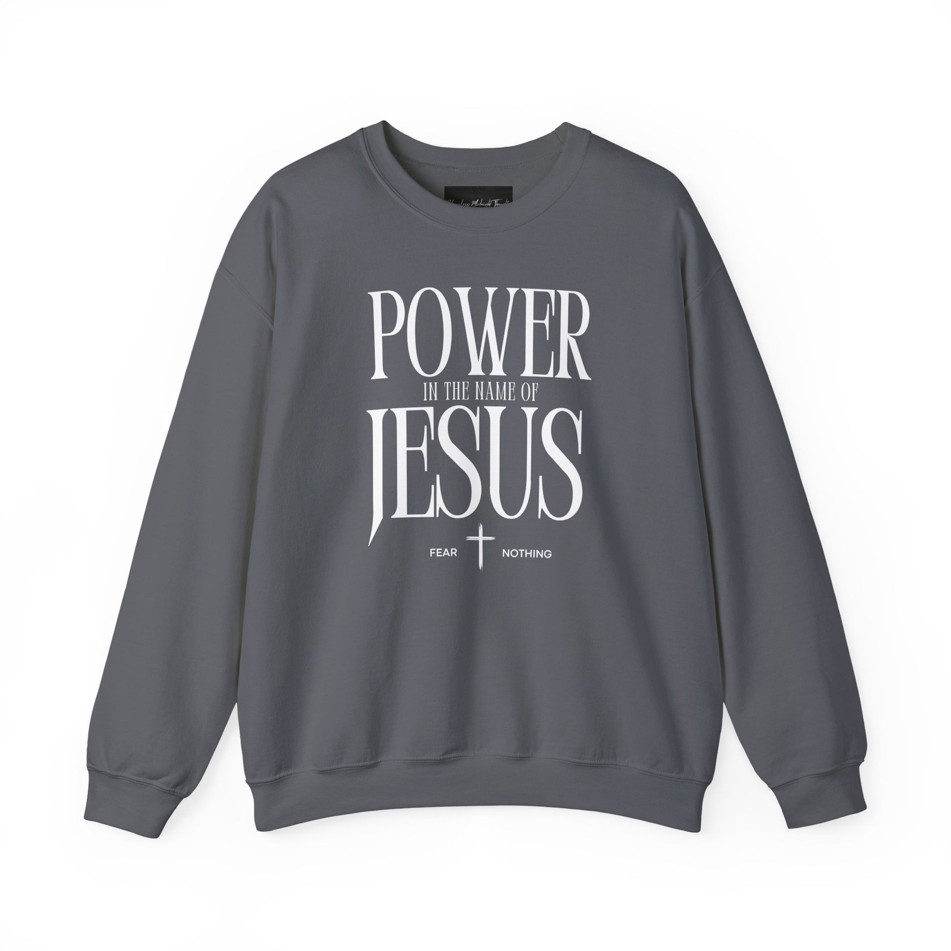 On the front of this Christian pullover sweatshirt it says Power In The Name Of Jesus with a Jesus cross underneath it, on either side of the cross are the words Fear and Nothing.
