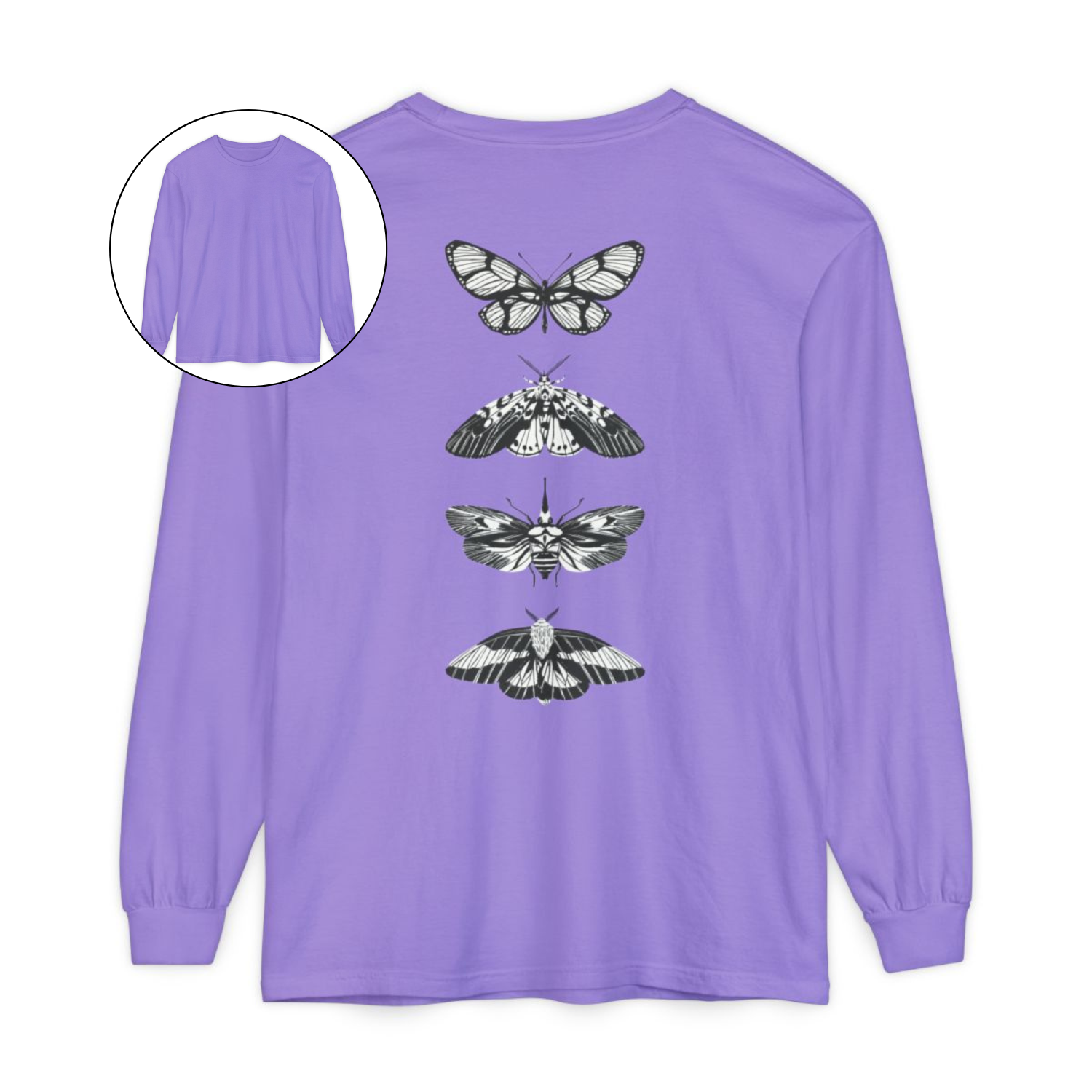 On the back of this long sleeve women's shirt right in between the shoulder blades is a row of black and white butterflies, starting at the top of the back and headed to the bottom of the shirt.