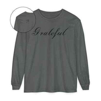 On the front of this custom long sleeve t-shirt in cursive writing is the word grateful on the upper chest, on the back left shoulder blade is an image of a heart with an exclamation mark next to it.