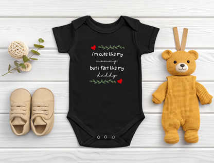 On the front of this custom short sleeve baby onesie are the words I'm cute like my mommy but I fart like my daddy with two hearts on either side of the writing.