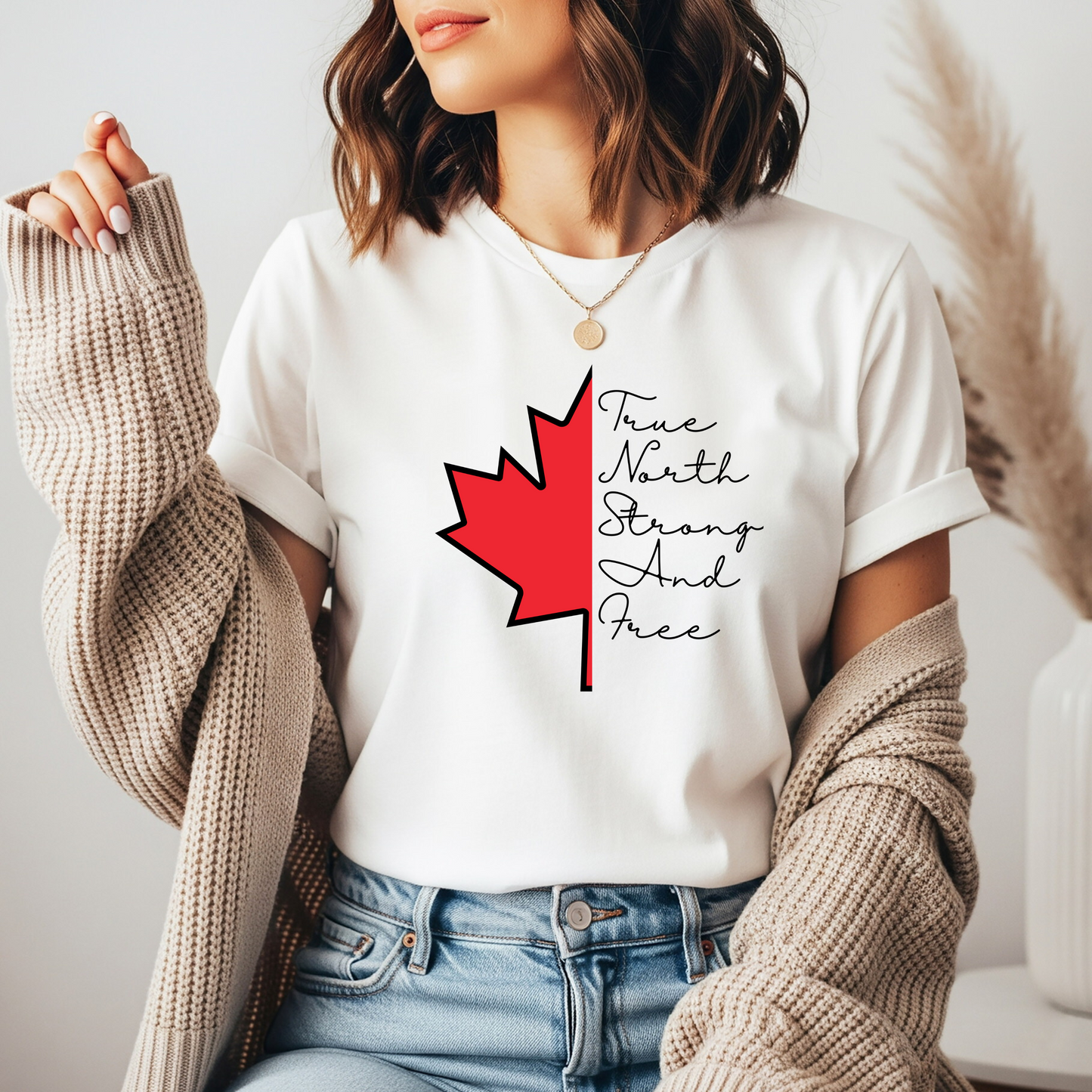 This custom handmade Canadian shirt comes with a maple leaf on the front center of the shirt, the words true north strong and free are in cursive on the other side of the maple leaf.