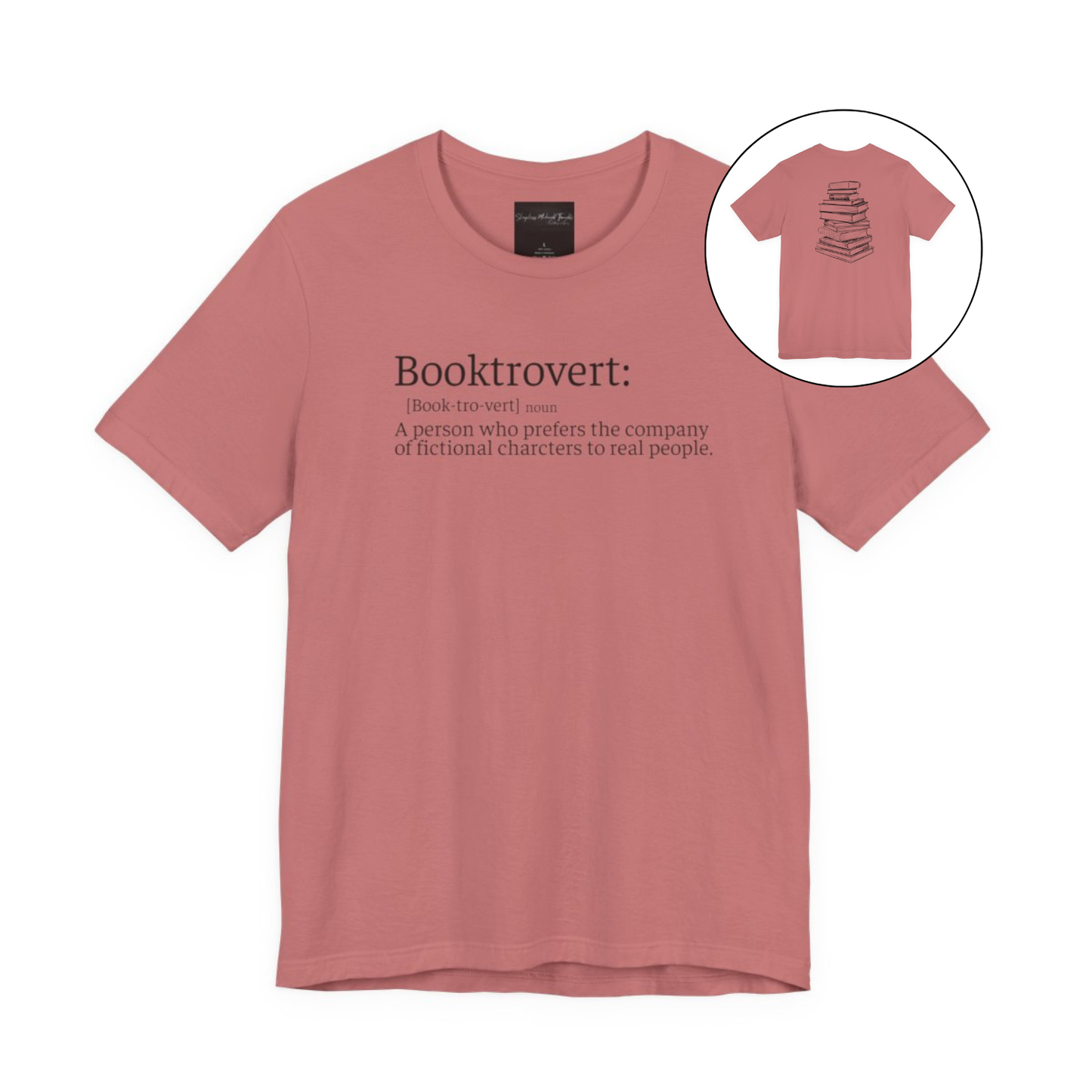 On the front of this custom unisex short sleeve shirt is the word booktrovert with the definition of the word underneath, on the back of the shirt is an image of a large stack of books.