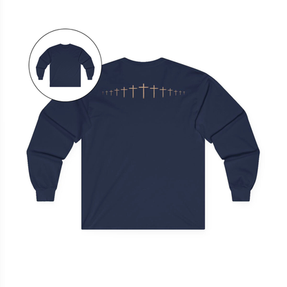On the back of this navy blue colored Christian long sleeve shirt is a large wooden Jesus cross in between the shoulder blades, the Jesus cross then keeps getting smaller and smaller till it fades right off the shirt giving it a amazing 3D look on the back.