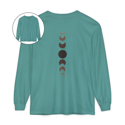 On the back of this custom unisex long sleeve t-shirt from the top of the shirt to the bottom are 7 images of the moon showing the moons cycle, every moon is a different shade of brown.