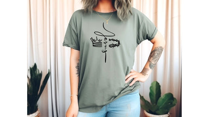 On the front of this custom Christian t-shirt is the name of Jesus in a cursive front from the top of the shirt facing towards the bottom, there is a crown on one side of the name and a crown of thorns on the other side of the name.