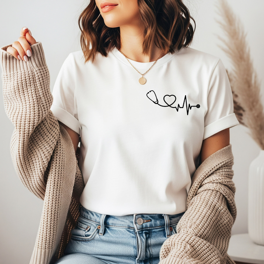 On the front of this custom health care workers shirt, on the left chest of the top is a stethoscope that has a heart and a heartbeat in the cord of the stethoscope.