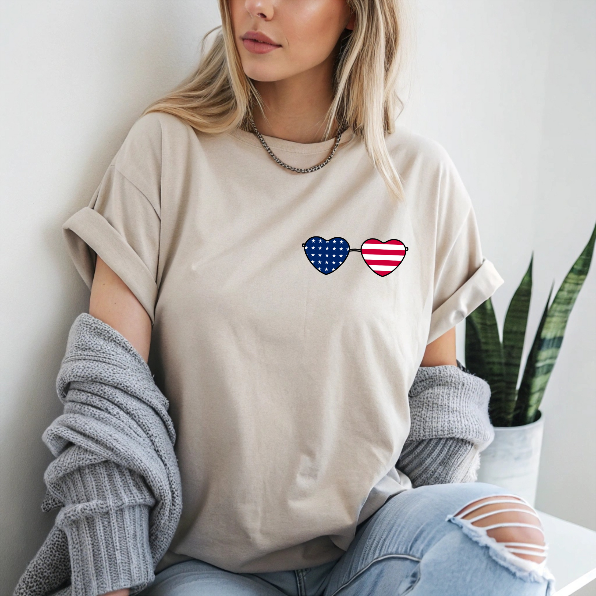 This super soft unisex t-shirt has a image of a pair of heart shaped sunglasses over the front left chest of the shirt, the American flag is inside the sunglasses. Perfect for 4th of July celebrations.