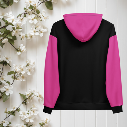 A women's custom oversized handmade hoodie, on the front and the back of the hoodie is the color black, the sleeves, front kangaroo pocket and hood are all a bright pink color, the strings of the sweater are black.