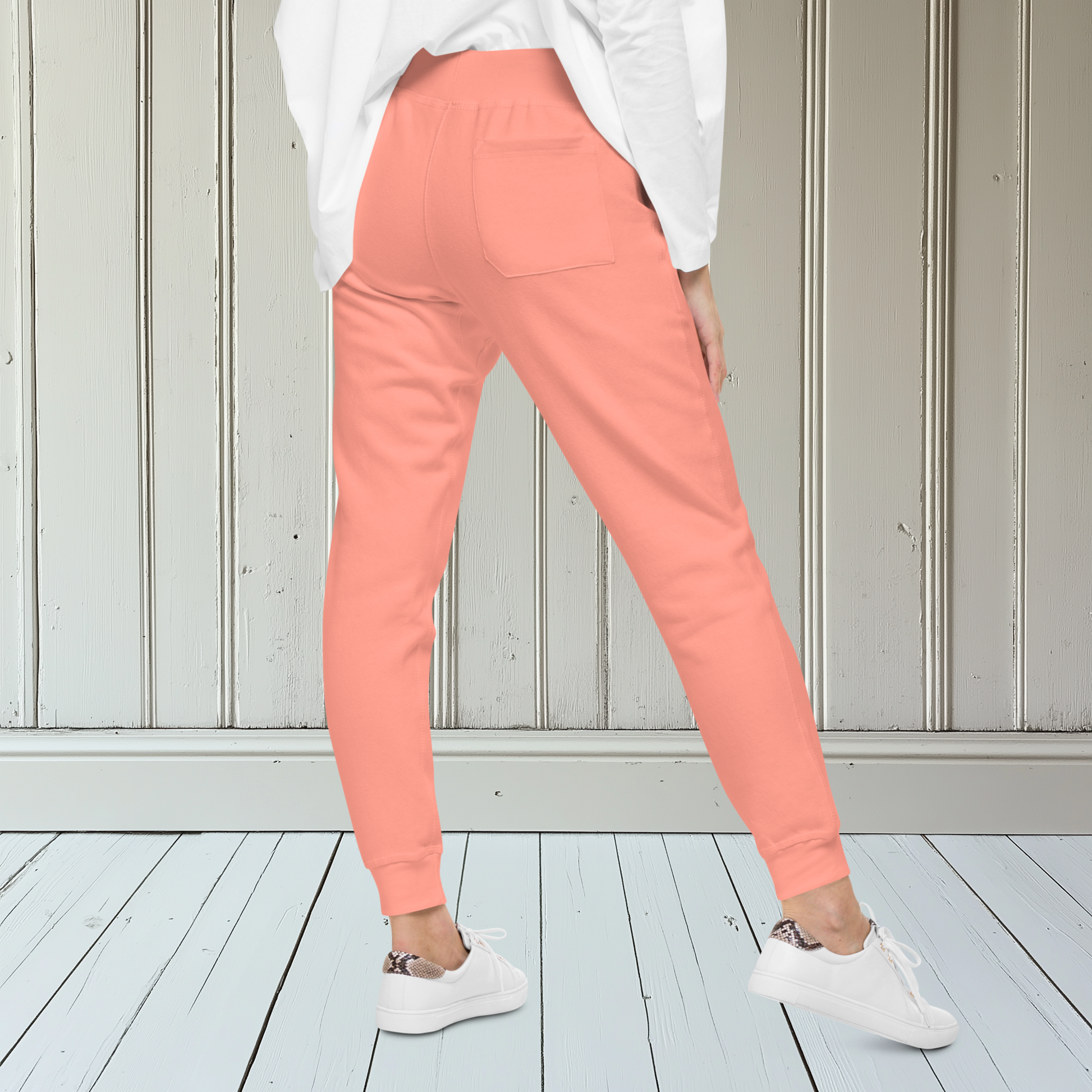 A pair of super soft ankle length Christian unisex sweatpants, there are two pockets on the front and one pocket on the back right, on the front left pocket is a embroidered white cross.