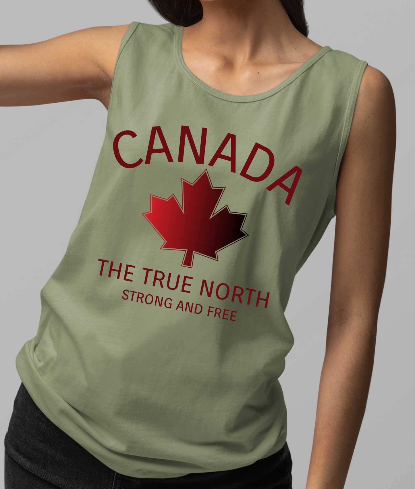 This custom unisex tank top has the word Canada in large block letters in a half circle on the top with a maple leaf underneath that, then under the the maple leaf are the words The True North Strong And Free in the same font, everything is a bright red color like the Canadian flag.