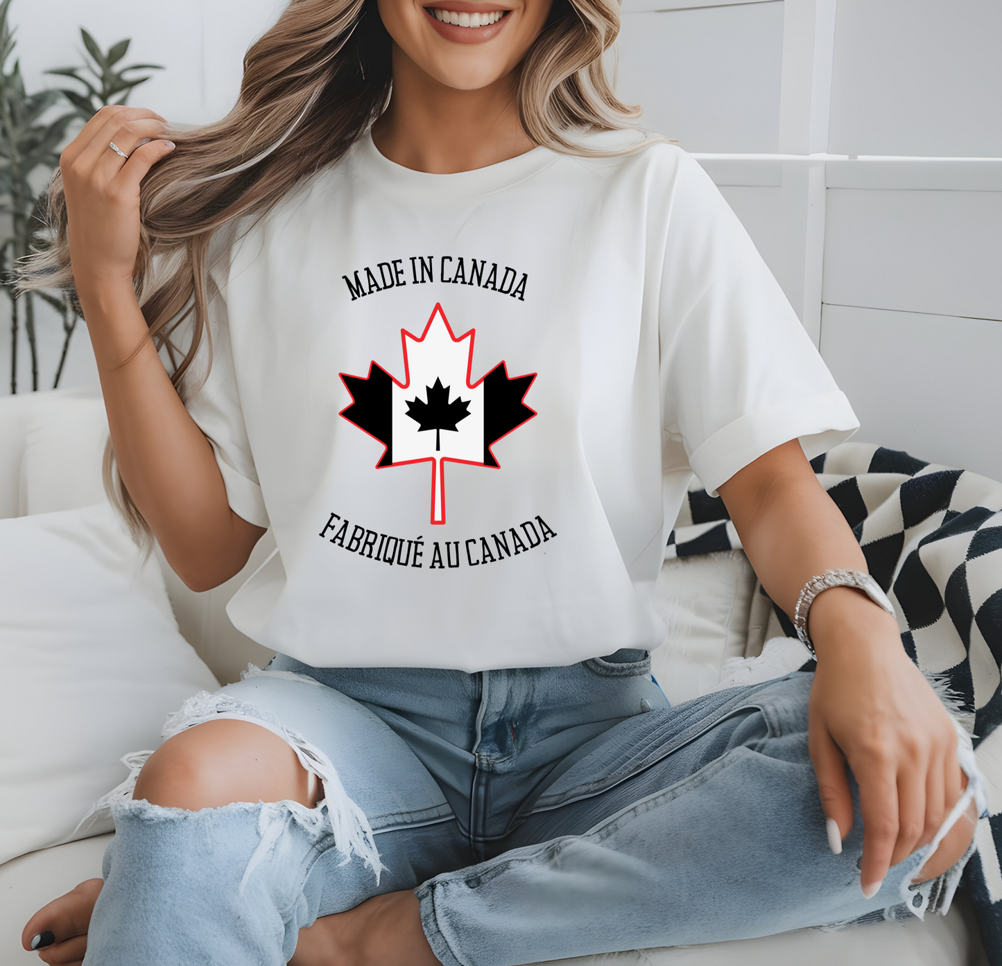 On the front of this custom unisex t-shirt is a large maple leaf with the Canadian flag on the inside, the words Made In Canada are above the maple leaf with the same in French underneath that says Fabrique Au Canada.