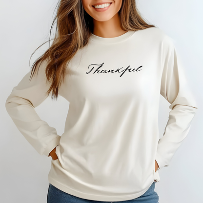 On the front of this custom unisex long sleeve t-shirt is the word thankful in a flowy cursive font.