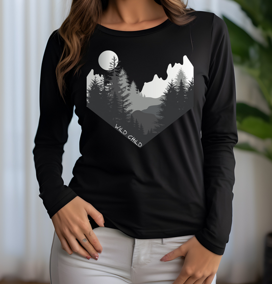 The image on the front of this custom long sleeve shirt is all in black and grey with there being mountains and trees on both sides in the shape on a v making it looking as if you are looking down a valley, the words wild child are in white on the bottom left of the image.
