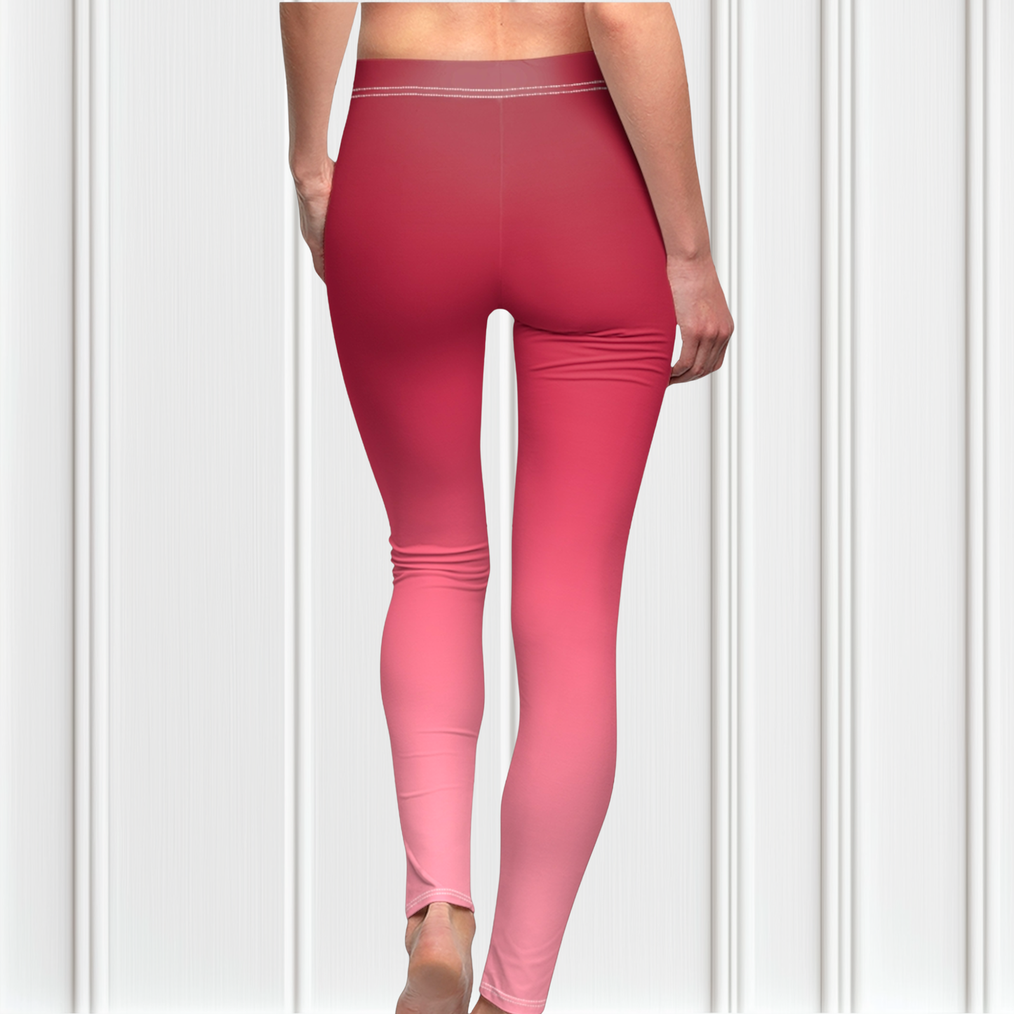 These custom handmade women's high waisted leggings have a pink ombre design with the top of the pants being a dark pink then it fading to a light baby pink at the ankles of the pants.