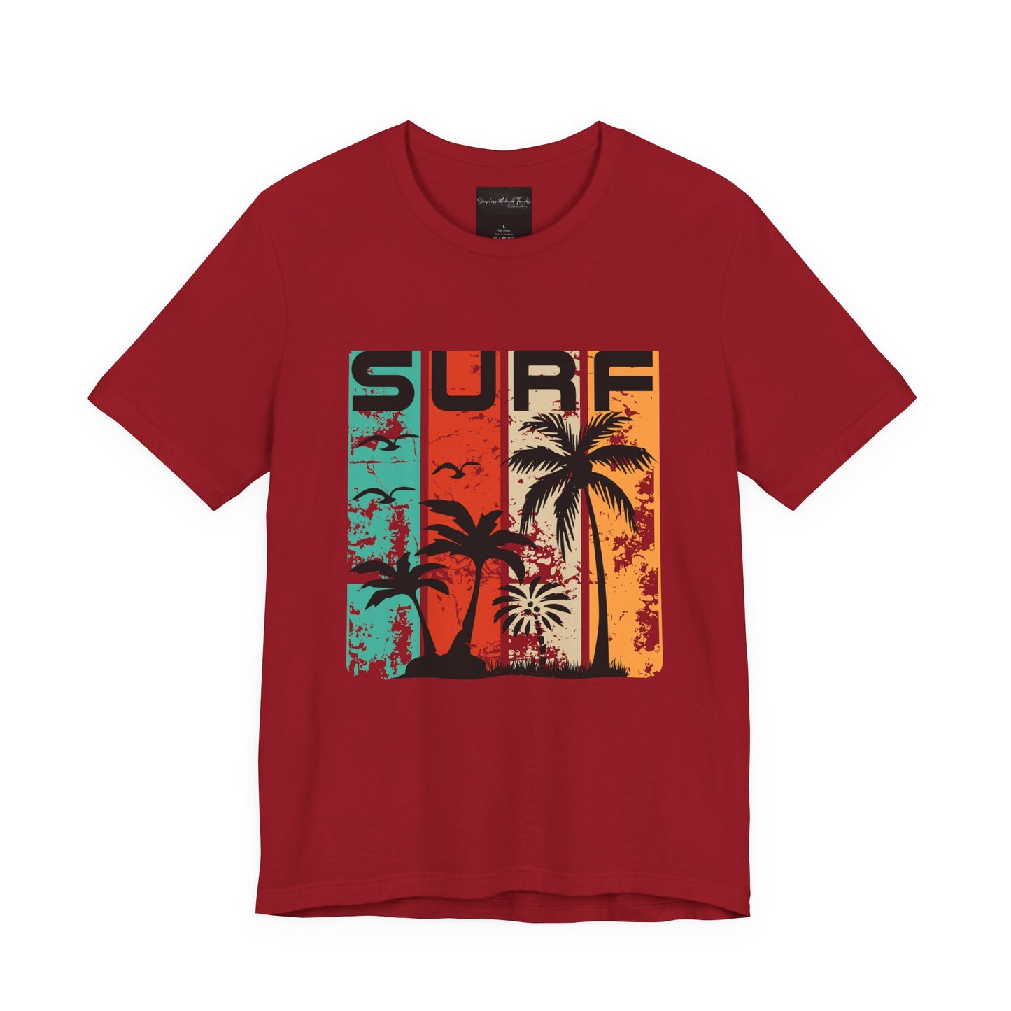 On the front of this custom vacation shirt is the word SURF in large letters at the top of the shirt, each letter has a different colored line through it to the bottom, there are images of palm trees and birds flying underneath the word.