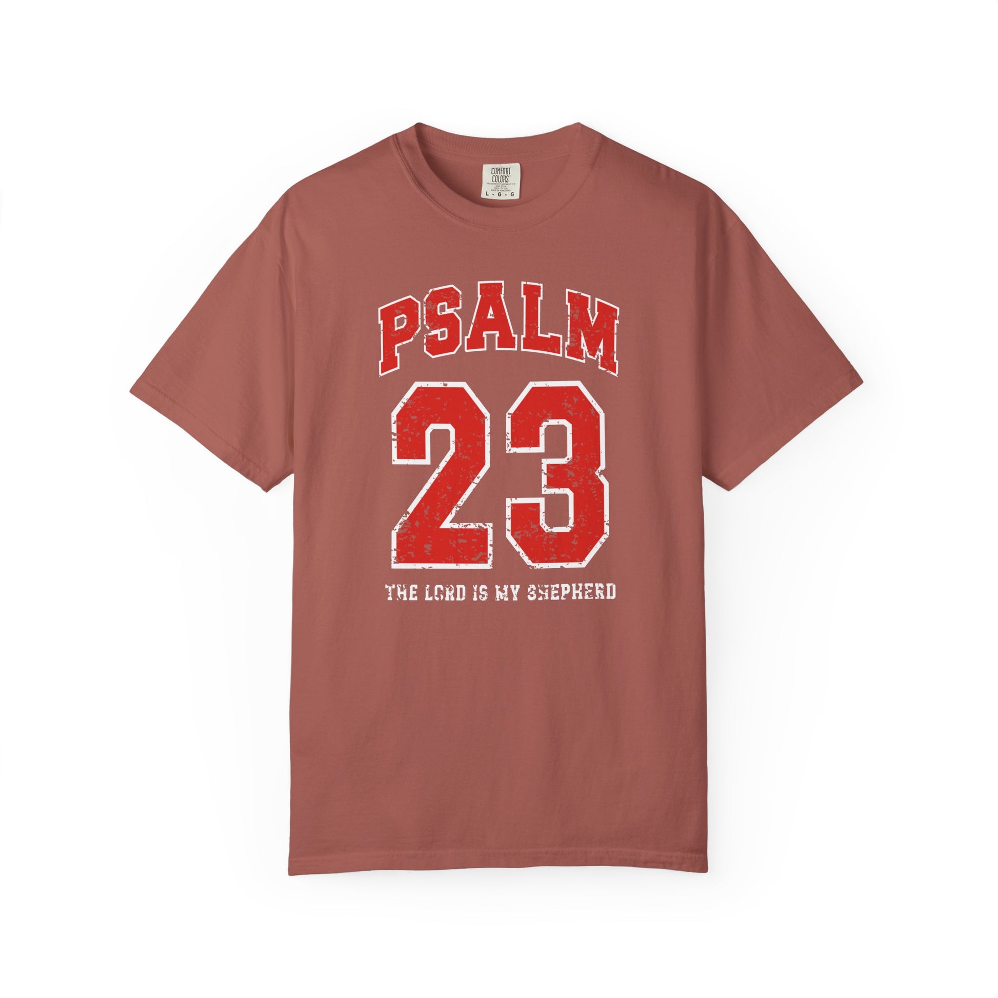 On the front side of this custom vintage t-shirt are the words Psalm 23 The Lord Is My Shepherd, it is with red and white block lettering.