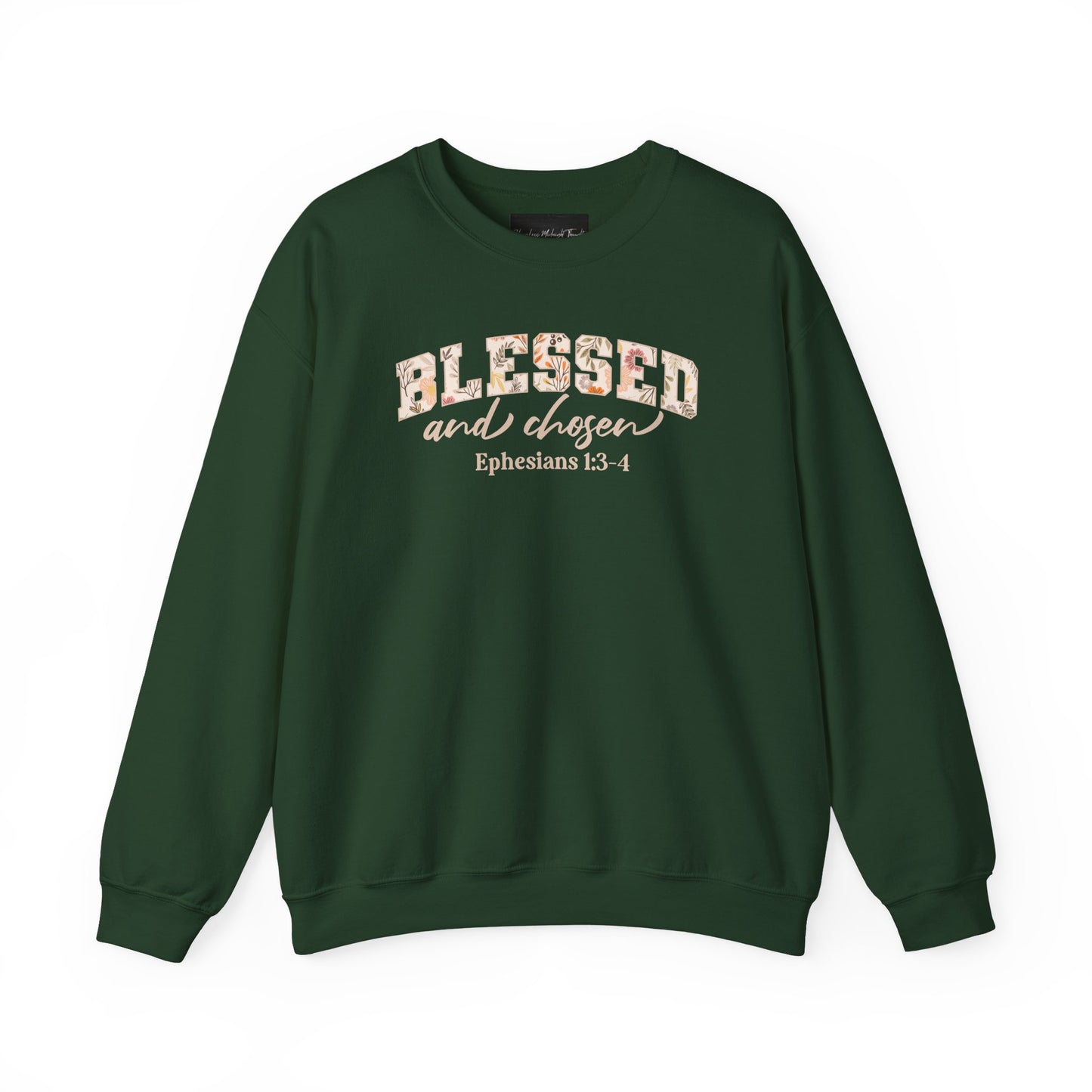 On the front of this custom Christian sweatshirt is the bible verse Blessed and Chosen Ephesians 1:3-4 with the word Blessed being in large bubble letters with a floral pattern on the inside of the letters.