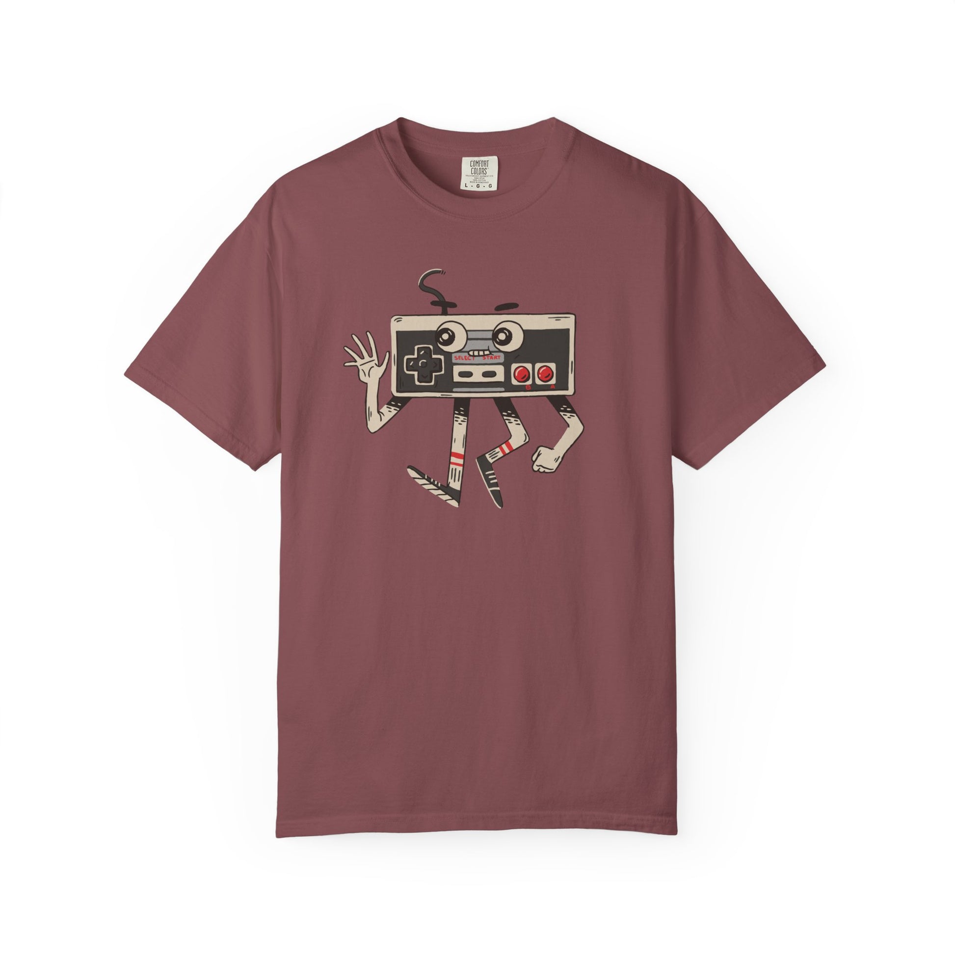 On the front of this custom vintage gaming short sleeve shirt is an image of a old school Nintendo controller, the controller has arms and legs and a face that makes it look like a cartoon character.