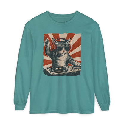 On the front of this custom retro long sleeve shirt is a DJ playing music, except the DJ is a cat that is wearing headphones, there is a vintage red and ivory background behind the cat.