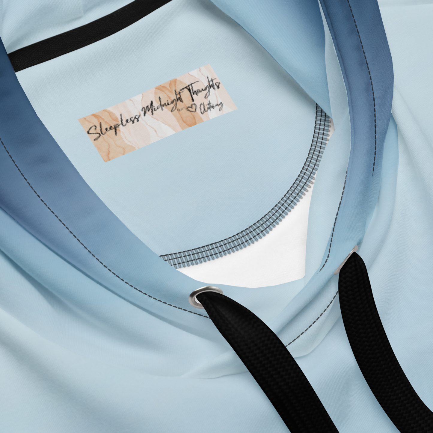 A custom handmade unisex pullover hooded sweatshirt with an ombre design with the top of the hoodie being a very light blue color then it slowly shifting to a navy blue at the bottom of the hoodie.