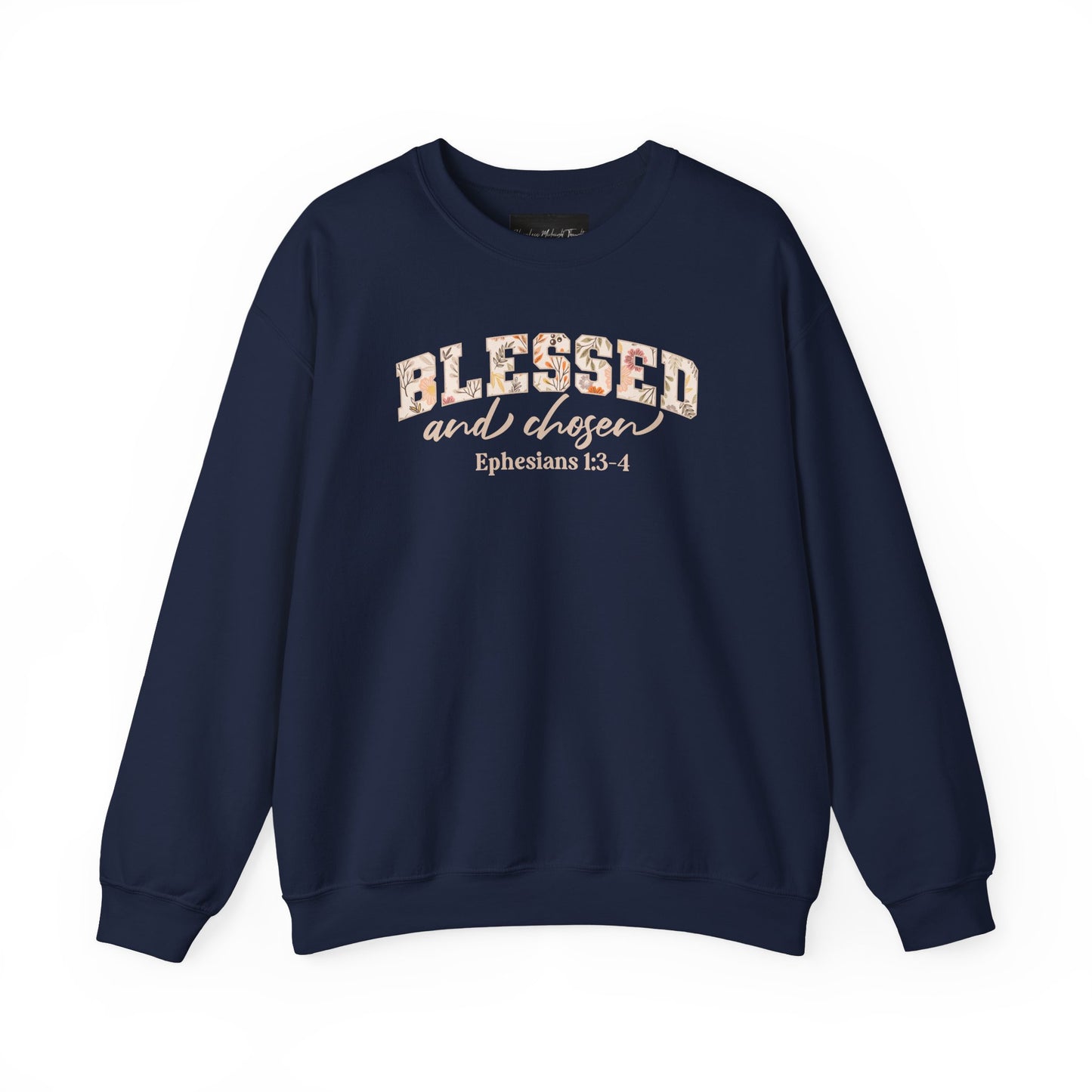 On the front of this custom Christian sweatshirt is the bible verse Blessed and Chosen Ephesians 1:3-4 with the word Blessed being in large bubble letters with a floral pattern on the inside of the letters.