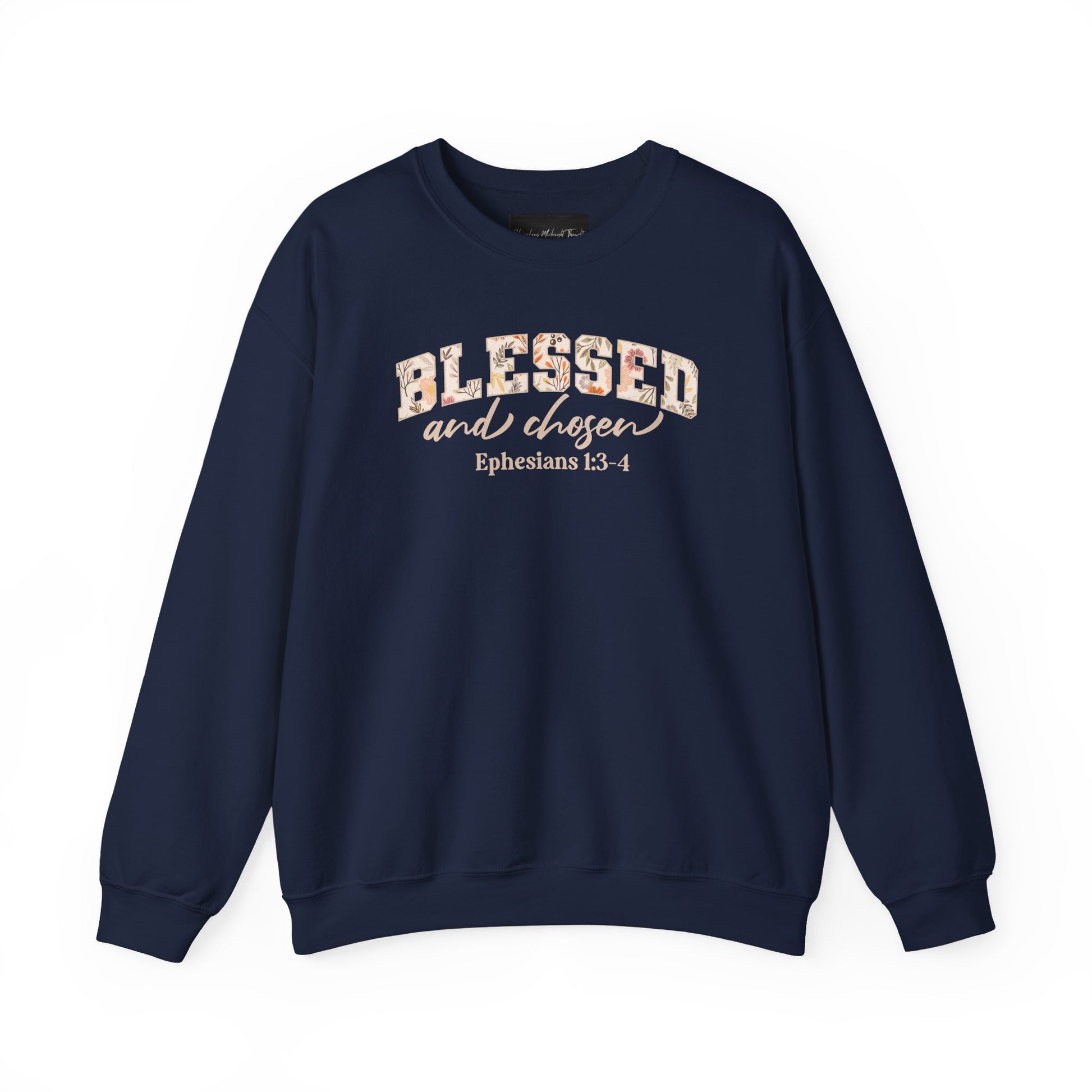 On the front of this custom Christian sweatshirt is the bible verse Blessed and Chosen Ephesians 1:3-4 with the word Blessed being in large bubble letters with a floral pattern on the inside of the letters.