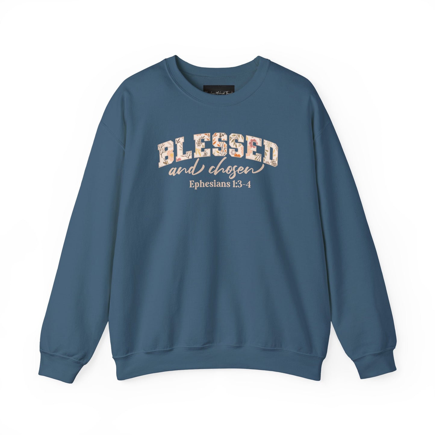 On the front of this custom Christian sweatshirt is the bible verse Blessed and Chosen Ephesians 1:3-4 with the word Blessed being in large bubble letters with a floral pattern on the inside of the letters.