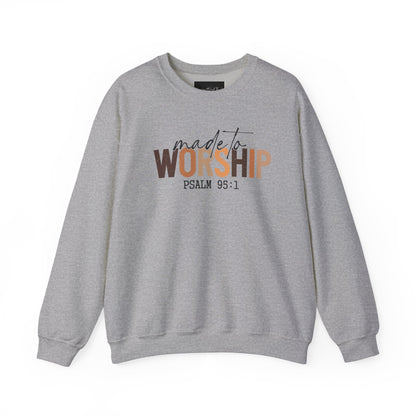 On the front of this Christian pullover sweatshirt it says Made To Worship Psalm 95:1, the word worship is done in large block letters with every letter being a different shade of brown.