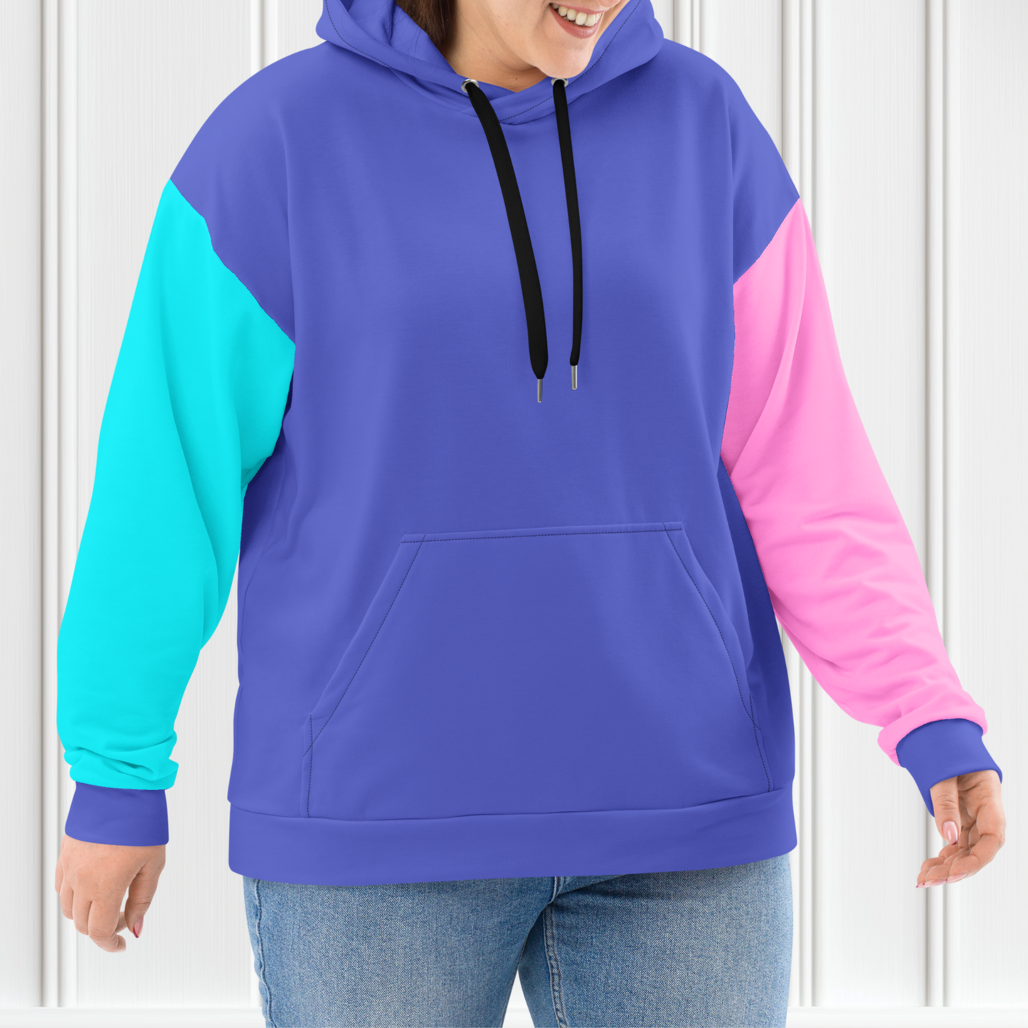 A custom hand sewn unisex hoodie that is purple on the front and the back along with the hood, the right sleeve is a bright turquoise blue with the left sleeve of the sweater being a bubblegum pink.
