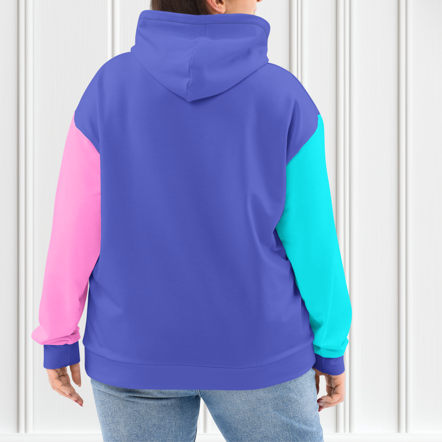 A custom hand sewn unisex hoodie that is purple on the front and the back along with the hood, the right sleeve is a bright turquoise blue with the left sleeve of the sweater being a bubblegum pink.